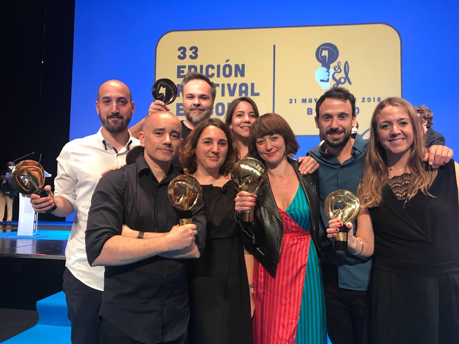 Group celebrating with awards at festival event